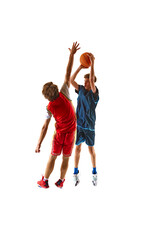 Dynamic shot of basketball player in blue aims for basket, while his opponent in red tries to...