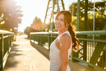 great sporty woman jogging outdoors on sunset time