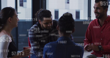 Image of changing numbers over diverse coworkers having coffee break and talking in office
