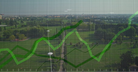 Image of statistical data processing against aerial view of grassland