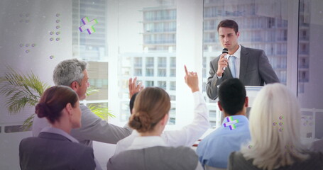 Image of abstract shapes over caucasian businessman asking question at business conference
