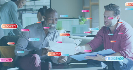 Image of notification bars with numbers, diverse male coworkers analyzing sales report in office