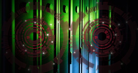 Image of two red round scanners spinning against computer server room