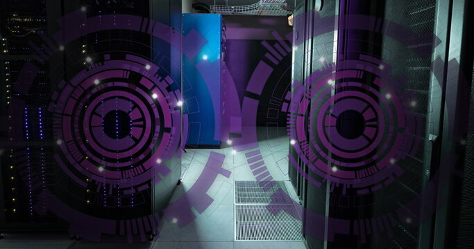 Image of two purple round scanner spinning against computer server room
