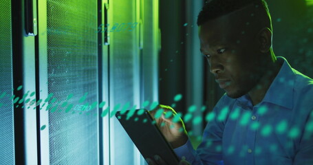 Image of data processing over african american male engineer using digital tablet at server room