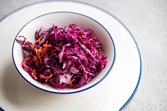 Close-up of a bowl of Red cabbage and carrot  salad on a plate