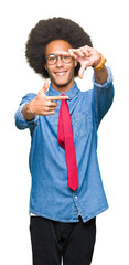 Young african american business man with afro hair wearing glasses and red tie smiling making frame with hands and fingers with happy face. Creativity and photography concept.