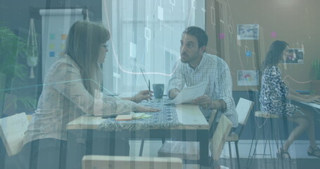 Image of multiple graphs and numbers over diverse coworkers discussing on desk in office