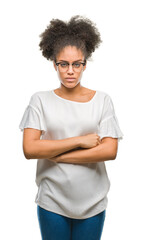 Young afro american woman wearing glasses over isolated background skeptic and nervous,...