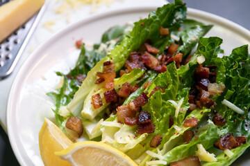 Cos lettuce salad with crispy bacon, and parmesan cheese. Easy healthy recipes.