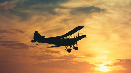 Fototapeta premium Vintage airplane flying in the sunset sky