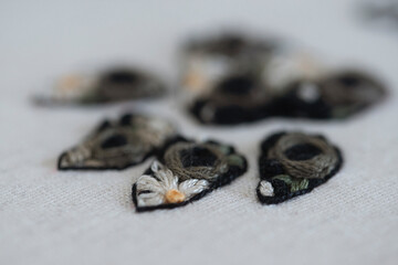 Close-up view of an embroidered cats paw print