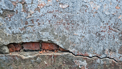 Texture of old rustic wall covered with gray and blue stucco. Multilayers of old paint on the wall. Textured background. Selective focus