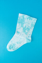 Tie dye socks on blue background. advertising, branding, Mock up, template.