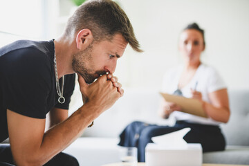 Man with psychologist theraphy social problems concept drug addiction talk to a psychological woman