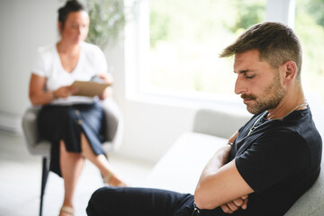 Man with psychologist theraphy social problems concept drug addiction talk to a psychological woman