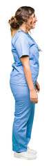 Young adult doctor woman wearing medical uniform looking to side, relax profile pose with natural face with confident smile.