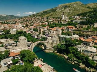  aerial view of the historic town of Mostar with famous Old Bridge , Bosnia and Herzegovina