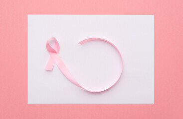 pink ribbon breast cancer awareness on white and pink background