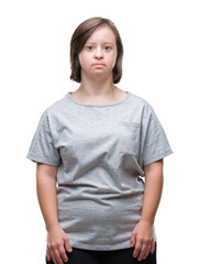 Young adult woman with down syndrome over isolated background with serious expression on face. Simple and natural looking at the camera.