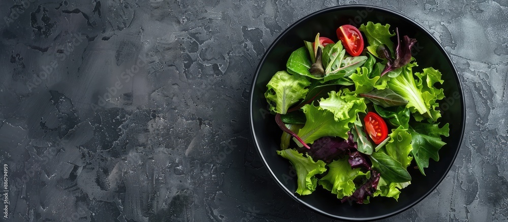 Poster Top view of a fresh salad bowl on a stone surface, with room for additional text or images in the frame.