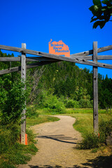 Drinking Horse Mountain Trail Entrance Sign along Bridger Creek in Bozeman, Montana: The Beautiful  Summer Sunrise Landscape on Northern Rocky Mountain Hiking Trail