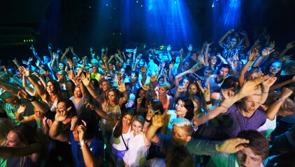 Enjoying every song the band plays. Shot of a large crowd at a music concert.