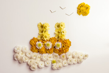 floral composition, ship on the sea and sun made from flowers, isolated, copy space