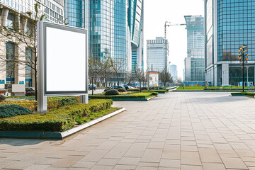 Fototapeta premium A blank billboard in a modern cityscape, providing ample space for advertisements or messages with an urban backdrop.