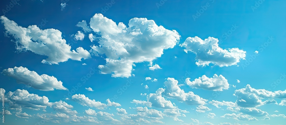 Poster the vast blue sky with clouds provides a serene backdrop for any copy space image.