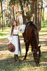 Portrait of beautiful blonde curl girl in medieval dress and fur vest on  nature with horse. Young worker in rural scene in forest.Warm colorful art work.