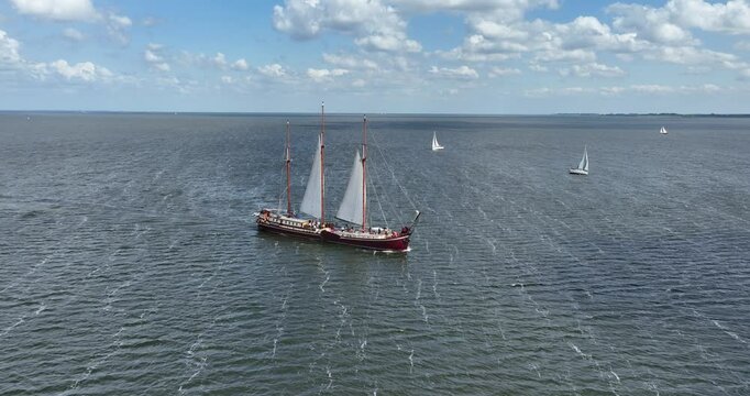A clipper sail ship on The Ijsselmeer, The Netherlands. Aerial view.