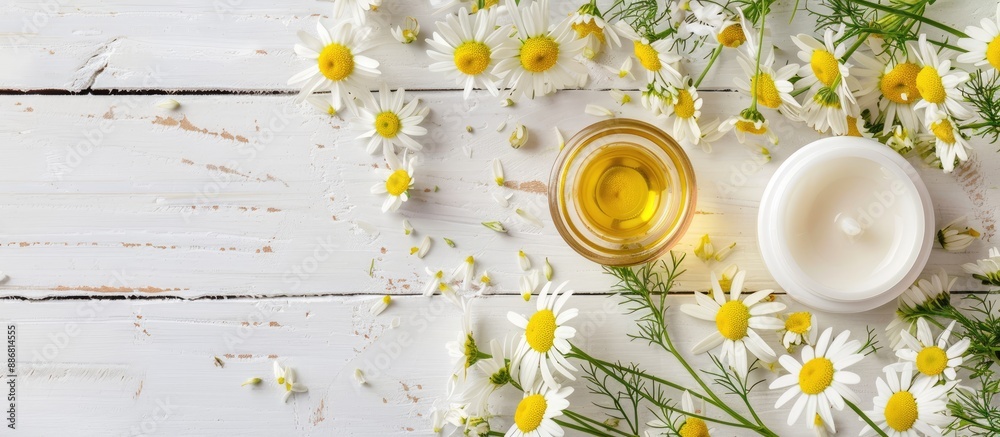 Poster chamomile flower beauty product samples displayed on a white wooden table with copy space image.