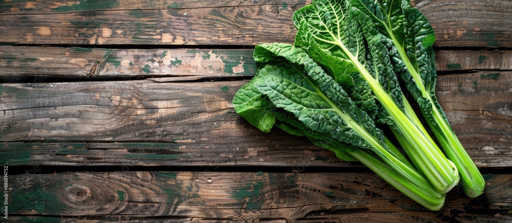 Aufkleber top view of chinese kale, a fresh vegetable, displayed on a wooden table background with copy space 