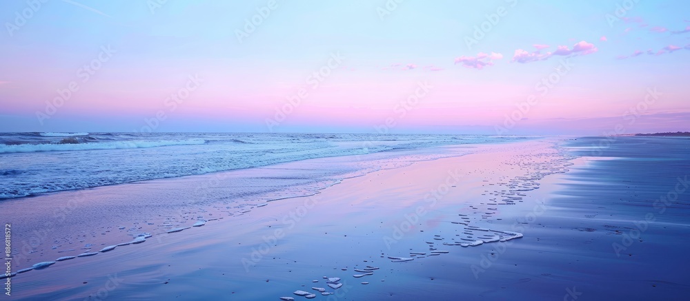 Poster seascape with a serene beach at sunset. the horizon filled with a blend of blue and pink hues, creat