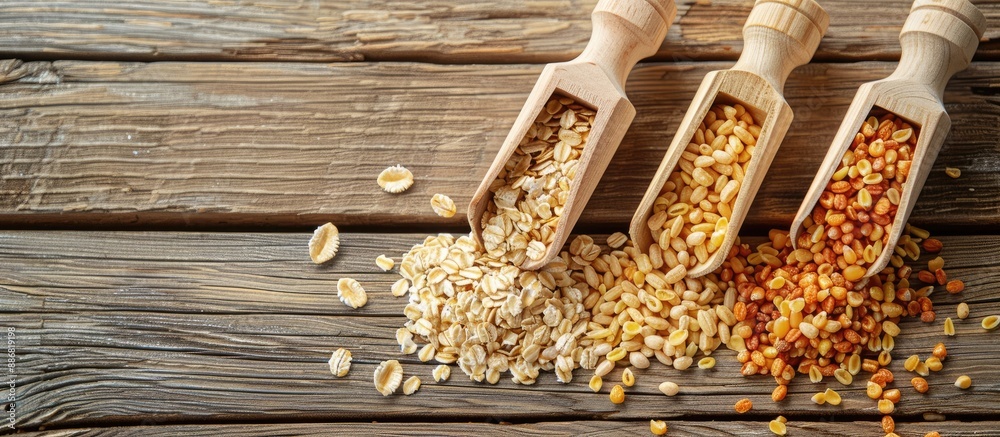 Poster wooden scoops for loose cereals displayed on a wooden background with copy space image.