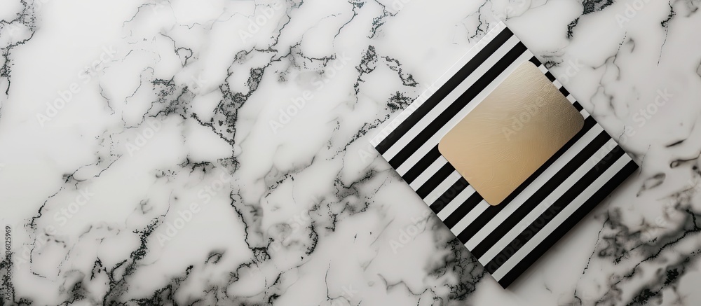Poster Top view of a striped employee badge and postcard arranged on a marble surface for a mockup with copy space image.