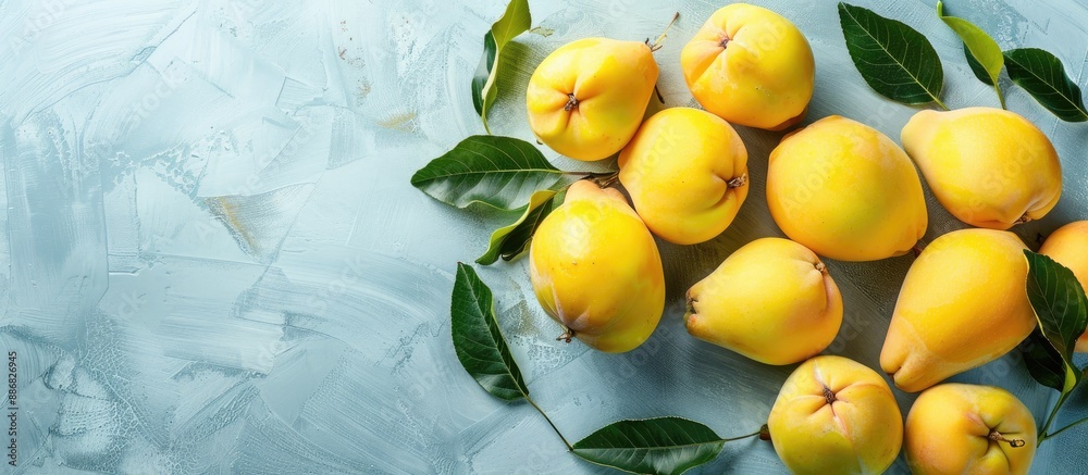 Poster a beautifully arranged display of organic quinces with leaves on a bright table in a flat lay style,
