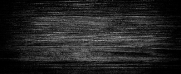 Obraz premium Dark black wooden background or texture