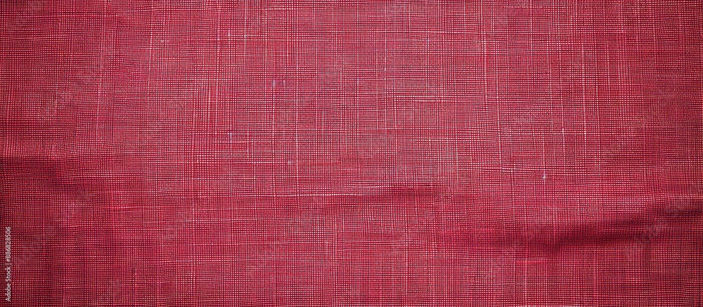 Fototapete detailed close-up image of a natural red fabric texture in a light red hue. made of cotton or linen,