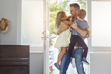 Family, father and children with hug and fun, love and hello at door with happiness in family home. Happy people, parent and kids with care, lifestyle and wellness with bond and excited together © ReeseArcurs/peopleimages.com