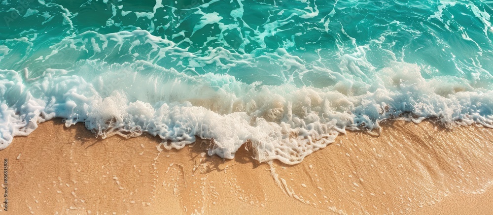 Poster a tranquil ocean wave on a sandy shore, perfect for a summer holiday backdrop with ample copy space 