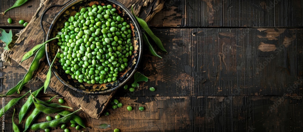 Poster plate of fresh green soybeans on a wooden table with a clear area for text or image insertion.