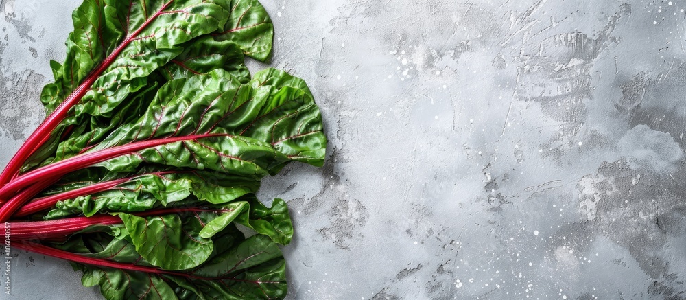 Aufkleber top view of healthy and highly nutritious raw chard leaves on a light background with copy space ima