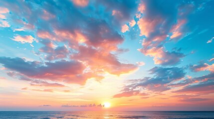 Obraz premium The sun sets over the ocean, painting the water with hues of orange and red A solitary boat dots the distance, while clouds tinted with pastel shades dot the