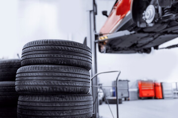 Concept car wheel service. Professional mechanic changing tires in garage