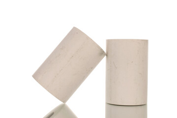 Two rolls of paper cash register tape, close-up isolated on white.