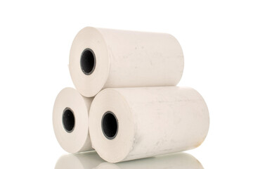 Three rolls of paper cash register tape, close-up isolated on white.