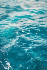 Fototapeta premium The water is calm and clear, with ripples forming on the surface. The blue color of the water is soothing and peaceful, creating a sense of tranquility