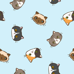 Obraz premium Seamless Pattern with Cartoon Cat Face Design on Light Blue Background